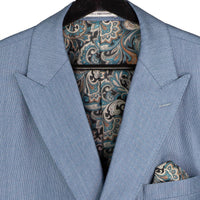 VINCI Men's Smoke Blue Sharkskin Double-Breasted Classic Fit Suit with Adjustable Waist – NEW. Features a peak lapel with pick stitch finish, upscale lining, and flat-front pants with flexible waistband and unfinished hems for custom tailoring. A refined and versatile suit for professional or evening wear. Available at Fashion House Inc. (FH Menswear, Style #DRK-5)
