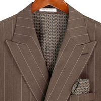VINCI Men's Brown Wide Stripe Double-Breasted 6 Button Regular Fit Suit – NEW. Features a bold wide pinstripe pattern, peak lapel jacket, ticket pocket, side vents, and flat-front pants with an adjustable waistband. A polished statement suit for business, formal, or evening wear. Available at Fashion House Inc. (FH Menswear, Style #DSS-5)