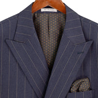VINCI Men's Denim Blue Wide Stripe Double-Breasted 6 Button Regular Fit Suit – NEW. Features a bold wide pinstripe pattern, peak lapel jacket, ticket pocket, side vents, and flat-front pants with an adjustable waistband. A polished statement suit for business, formal, or evening wear. Available at Fashion House Inc. (FH Menswear, Style #DSS-5)