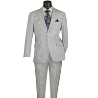 VINCI Men's Green Striped Seersucker 2-Button Modern Fit Cotton Suit - NEW. Contemporary trim fit with a breathable cotton fabric, fully lined jacket with notch lapel, and non-pleated trousers ready for custom tailoring. Ideal for both professional and social settings. Available at Fashion House Inc. (FH Menswear)