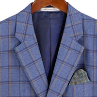 VINCI Men's Blue Windowpane 3 Piece Modern Fit Suit – NEW. Features a bold peak lapel jacket, matching vest, and flat-front pants with elastic waistband and unfinished hems for custom tailoring. A sharp, versatile choice for business or formal occasions. Available at Fashion House Inc. (FH Menswear, Style #F-MV2W4)