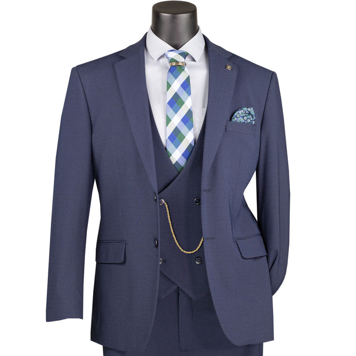VINCI Men's Navy Blue 3pc Super Stretch Modern Fit Suit with Adjustable Waist – Machine Washable – NEW. Features a sleek notch lapel jacket, flat-front pants, and flexible, washable fabric. Ideal for versatile, everyday elegance. Available at Fashion House Inc. (FH Menswear)