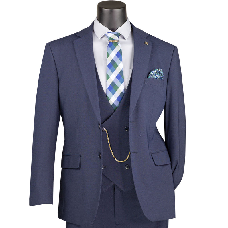 VINCI Men's Navy Blue 3pc Super Stretch Modern Fit Suit with Adjustable Waist – Machine Washable – NEW. Features a sleek notch lapel jacket, flat-front pants, and flexible, washable fabric. Ideal for versatile, everyday elegance. Available at Fashion House Inc. (FH Menswear)