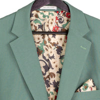 VINCI Men's Sage Green 3pc Super Stretch Modern Fit Suit with Adjustable Waist – Machine Washable – NEW. Features a sleek notch lapel jacket, flat-front pants, and flexible, washable fabric. Ideal for versatile, everyday elegance. Available at Fashion House Inc. (FH Menswear)