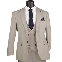 VINCI Men's Tan 3pc Super Stretch Modern Fit Suit with Adjustable Waist – Machine Washable – NEW. Features a sleek notch lapel jacket, flat-front pants, and flexible, washable fabric. Ideal for versatile, everyday elegance. Available at Fashion House Inc. (FH Menswear)