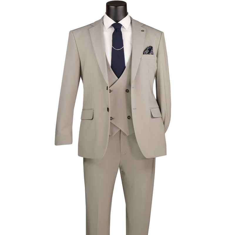 VINCI Men's Tan 3pc Super Stretch Modern Fit Suit with Adjustable Waist – Machine Washable – NEW. Features a sleek notch lapel jacket, flat-front pants, and flexible, washable fabric. Ideal for versatile, everyday elegance. Available at Fashion House Inc. (FH Menswear)