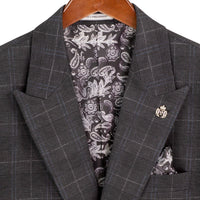 VINCI Men's Black Plaid Stretch 3 Piece Slim Fit 1 Button Suit – NEW. Features a bold peak lapel jacket with one-button closure, low cut vest, and flat-front pants with unfinished hems for custom tailoring. A modern, stylish choice for office or evening wear. Available at Fashion House Inc. (FH Menswear, Style #SV1W-1)