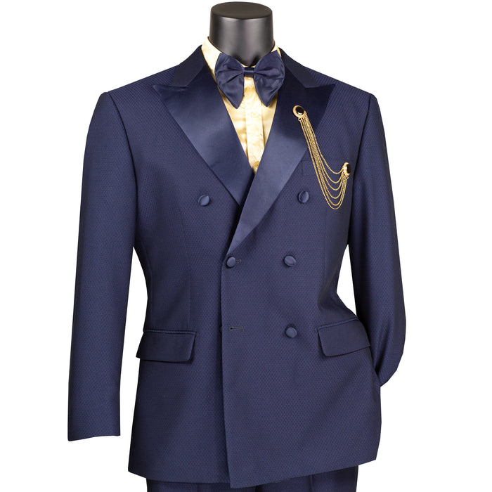 VINCI Men's Navy Blue Double-Breasted Modern Fit Tuxedo with Sateen Trim and Adjustable Waist – NEW. Features an oversized sateen peak lapel, fully lined jacket, flat-front pants with flexible waistband, and unfinished hems for custom tailoring. A bold, elegant choice for black-tie events. Available at Fashion House Inc. (FH Menswear, Style #TMDB-1)