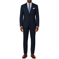 VINCI Men's Navy Blue 2-Button Suit with Adjustable Waistband, Regular-Fit - NEW. Features a notch lapel jacket luxuriously lined for comfort and non-pleated trousers designed for a custom fit. Ideal for both office and elegant evening wear. Available at Fashion House Inc. (FH Menswear)