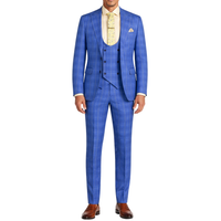 VINCI Men's Blue Plaid Stretch 3 Piece Slim Fit 1 Button Suit – NEW. Features a bold peak lapel jacket with one-button closure, low cut vest, and flat-front pants with unfinished hems for custom tailoring. A modern, stylish choice for office or evening wear. Available at Fashion House Inc. (FH Menswear, Style #SV1W-1)